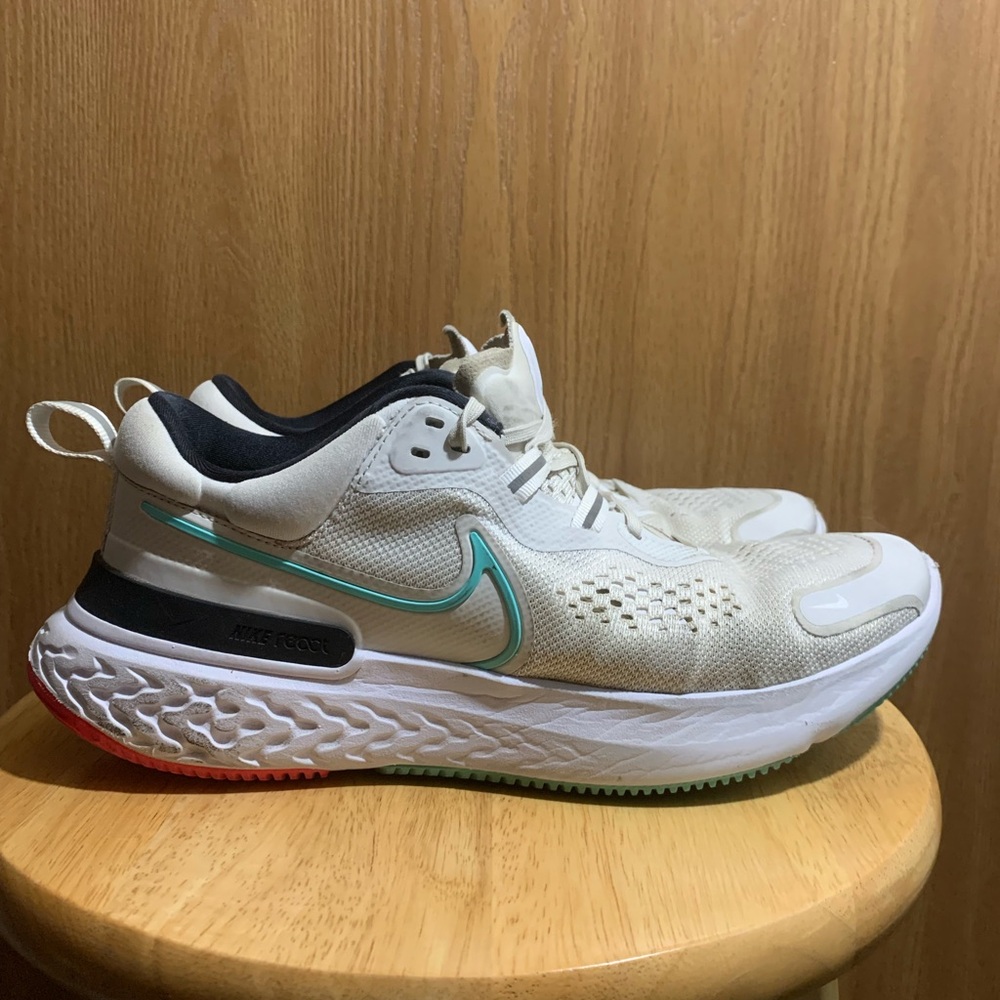 Heavily Used Nike White and Black Running Shoes